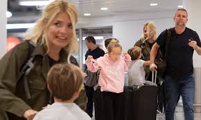 Holly willoughby reveals that she won't any more kids for a little while. Holly Willoughby Touches Down In London With Family Ahead Of Return To Dancing On Ice Hosting Duties Daily Mail Online