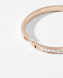 You can use your fingernail to flip it open. Swarovski Crystal Bangle Clear Bracelets Ted Baker Row