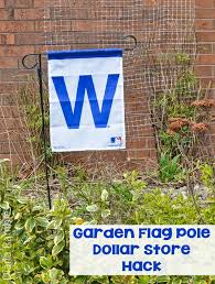 I have always wanted a flag flying in front of my home and it has been far too long around our place without one. Garden Flag Pole Dollar Store Quick Hack