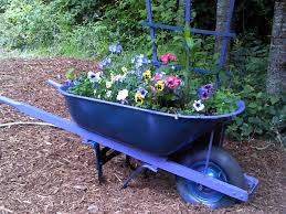 Pin By Linda Gene Brown On Garden Creations Wheelbarrow Planter Wheelbarrow Wheelbarrow Garden