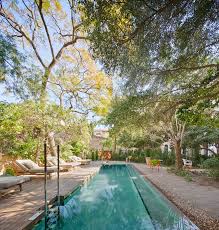 The present and the past reconcile with each other in the spacious private garden, which is replete with luxurious vegetation, and where guests can get lost between paths full of light and shadow. Can Bordoy Grand House Garden Palma Spain Ohlab Urdesignmag