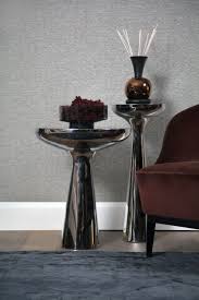 Sensuous Curves Of The Lindos Round Side Table Are Perfect Accent Pieces To Display Sculptures White Furniture Living Room Side Table Luxury Furniture Showroom