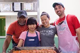 volunteer with meatloaf kitchen