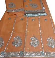 Lite Orange Poshak With Golden Flower And Green Thread Work How to stitch gota patti work, how to stitch gota patti zardosi gota patti stitch gota patti design gota patti stitch for hand gota patti. beendani