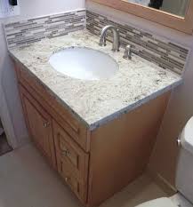 Installation runs from $200 to $1,000 per vanity. How To Install Vanity Granite Top Stone Glass Backsplash Schluter Bt Ti Tile Backsplash Bathroom Vanity Backsplash Bathroom Backsplash