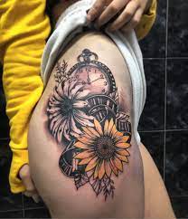 Sunflowers Film Clock Tattoo By Area 87 At Athens Tattoo Studio Clock Tattoo Sleeve Thigh Tattoos Women Clock Tattoos For Women
