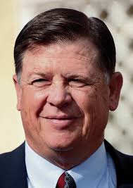 Radio spot suggests Dunn might benefit from power line, offers little proof 