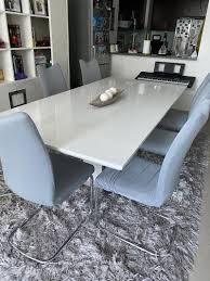 Table with separate extension leaf extends by pulling both ends and dropping in leaf. White Modern White 8 Seater Dining Table Models And Price Decosouq