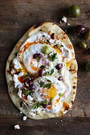 Turkish Eggs Fried Eggs With Labneh Feta Olives And Smoked Chili Butter On Naan Pita Lepinja Food Meals Brunch Recipes