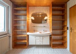 This bathroom by jennifer worts also features a beveled mirror for extra reflection and an acrylic stool for a touch of modern style. Natural Wood Gray And White How To Update A 90 S Bathroom Archdaily