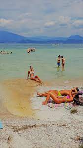 It is not a large but very unique place. Jamaica Beach Sirmione A Popular Spot For Locals To Cool Off During Summer Jamaica Beaches Sirmione Lake Garda Italy