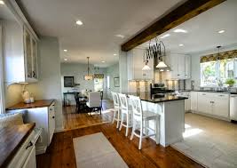 View of the dining room through an open doorway clad in stone bricks. Remodelaholic Creating An Open Kitchen And Dining Room