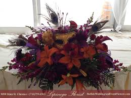 The couple most likely to make the most of a masquerade theme have an inner theatrical flair, and a love of the dramatic. Masquerade Wedding Flowers Buffalo Wedding Event Flowers By Lipinoga Florist