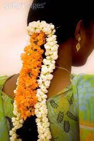 Arabian jasmine flowers are called mogra in hindi, kundu mallikai poo in tamil, mallige in kannada and it is the national flower of philippines and is called sampaguita. Indian Woman With Jasmine Flowers In Her Hair Flowers In Hair Flowers Her Hair