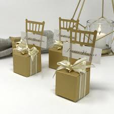 bring your own chair these miniature gold chairs are both place card holders and favor boxes a sophisticated and functional accent for your wedding or anni