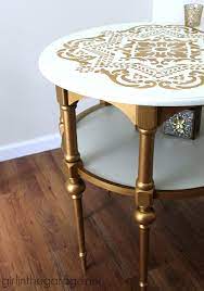 The style of the piece you are painting is what determines the style of the finished product to a certain extent, unless you plan to hand paint in a highly decorative style. Gold And White Stenciled Table Themed Makeover
