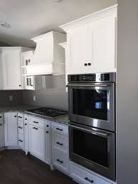 No matter your style or budget, lowe's has kitchen cabinetry solutions to. White Kitchen Cabinets With Double Oven Gas Cooktop And White Hood White Kitchen Cabinets White Modern Kitchen Modern White Kitchen Cabinets