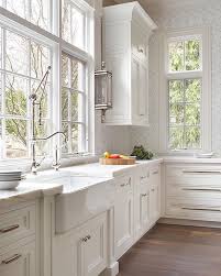 When designing kitchens that never go out of style, builders and interior designers mostly use natural materials. Interior Design On Instagram Beautiful Classic White Kitchen That Will Never Go Out Of Classic White Kitchen Kitchen Window Design White Farmhouse Kitchens