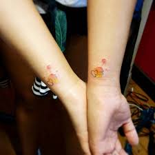 This is probably one of the best watercolor tattoos that is best suited for an individual who wants something that speaks the language of love on their arms. Wrist Matching Watercolor Tattoos
