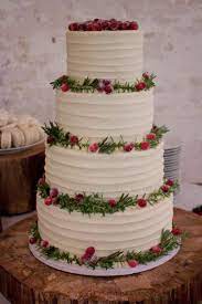 Simple Buttercream Iced Wedding Cake Decorated With Fresh Rosemary And Sugar Frosted Cranb Wedding Cake Pops Wedding Cake Simple Buttercream Cool Wedding Cakes