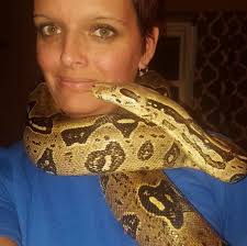 Woman found dead with 8ft python round her neck in house filled with 140  snakes