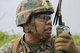 Cpl. Tyler J. Slim radios his platoon commander during