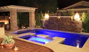 Stacked Stone Wall With Waterfalls Make This Pool Something Special Geometric Pool Backyard Pool Swimming Pool Images Backyard Pool Designs