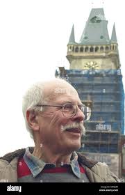 09 March 2018, Czech Republic, Prague: Petr Skala stands in front of the  townhall's tower in the old city centre. He is responsible for the accuracy  of the 600-year-old tower clock. The