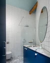 Bathroom renovated with mosaic of grey tiles. Thirty Bathrooms By Architects Including Concrete Stone And Tiled Designs