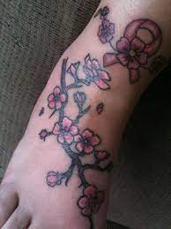 150 Cherry Blossom Tattoos Meanings Ultimate Guide 2021 Cherry Blossom Tattoo Meaning Awareness Ribbons Tattoo Cherry Blossom Tattoo Design