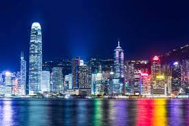 Skyline reflected in glass facade of a modern building. Leung Cho Pan Hong Kong Skyline At Night Art Print Canvas On Stretcher