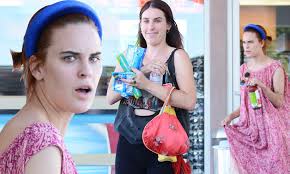 Scout Willis smiles mischievously as she and sister Tallulah Willis go
