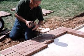 Run a tamper over the patio to set the bricks. Do It Yourself Brick Patio Walk Extreme How To