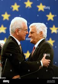 New European Parliament President Jerzy Buzek of Poland, right is  congratulated by former European Parliament President Hans-Gert Poettering  of Germany at the European Parliament in Strasbourg eastern France,  Tuesday, July 14, 2009. (