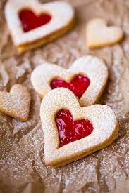 You can tint the marshmallow pink or red with a little food coloring and then top it with sprinkles or sparkly sanding sugar. Linzer Cookies Cooking Classy