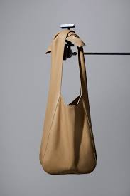 Create your bag combining colours. The Donna Hobo Bag In Camel Jonathan Simkhai