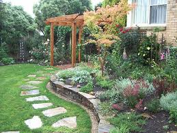 Garden With Castlemaine Slate Stepping Stones Stone Wall And Acer Palmatum Senkaki Set Amongst Mixed Plantings Garden Garden Design Landscape Design