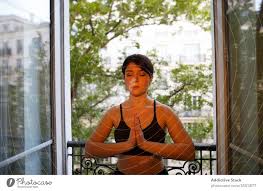 Maybe you would like to learn more about one of these? Calm Standing In Prayer Pose On Balcony In Summer A Royalty Free Stock Photo From Photocase