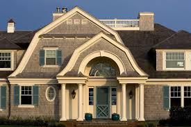 Teal cedar shakes and shingles have a special warmth and elegance, an architectural look that states classic quality, taste and timelessness. Teal Shutters With Victorian Exterior And Arched Doorway Blue Cedar Shakes Cedar Shingles Columns Deck Eyebrow Wind Gambrel House Exterior Cedar Shingle Siding