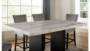The 42 square counter dining table features a faux marble top in a beautiful white and gray pattern that is set off by the black solid wood table frame. Messa Marble Top Counter High Dining Table