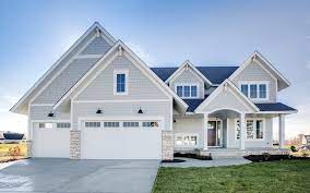 It's a clean, classy look. Arctic White Trim Light Mist Shakes Lap Country Ledgestone White Oak Stone Pewter Gray Blen White Exterior Houses Gray House Exterior Modern Farmhouse Exterior