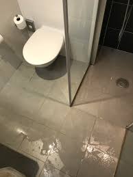 Floors that slope 2 or 3 inches in 20 feet would be a very serious concern. A Shower With No Base And A Crappy Seal A Floor That Slopes Away From The Drain A Metric Fuckton Of Standing Water Everywhere Except The Shower Crappydesign
