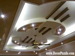 Gypsum boards are added along the ends of the ceiling and on sealed light fixtures are installed to bring in the wow factor. Pop Modern Main Hall Fall Ceiling Design Novocom Top