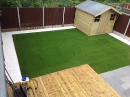 Lay artificial grass over crazy paving. Lawn Land Artificial Grass Finished With White Pebble Boarders Clients Gardens White Pebbles Grass Lawn