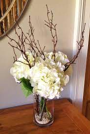 Fake Hydrangea Floral Arrangement With Twigs Set In Still Water Fake Flower Centerpieces Fake Flower Arrangements Dining Room Centerpiece