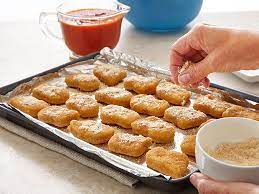 Coat the chicken pieces in the flour, egg, then the breadcrumbs and place onto the prepared baking sheet. Parmesan Baked Chicken Nuggets Perdue