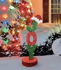 The letters j, o, y are painted a vibrant red that contrast nicely with the. Northlight 43 5 Rotating Red And Green Lighted Joy Sign Christmas Outdoor Decoration Reviews Wayfair