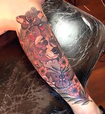 The same is true of this tattoo. Flowers Butterflies Bear Tattoo Idea