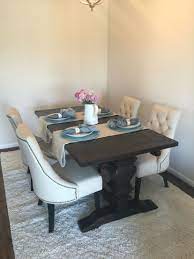 Often, people like to place armchairs at the heads of the table as feature pieces in contrast to side chairs. World Market Arcadia Dining Table And Lydia Linen Chairs Round Back Dining Chairs World Market Dining Chairs Vintage Dining Room