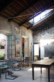 Industrial style cafe table and chair. Italian Interiors Vintage Industrial Interior Style In Milan